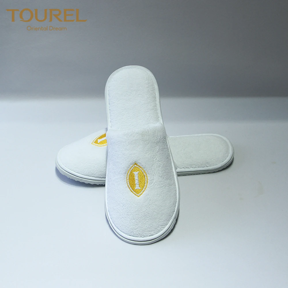 Pantoufle jetable blanche gaufrée lavable de spa et de douche d'hôtel personnalisée en gros à prix bon marché pour chambre d'hôte d'hôtel unisexe