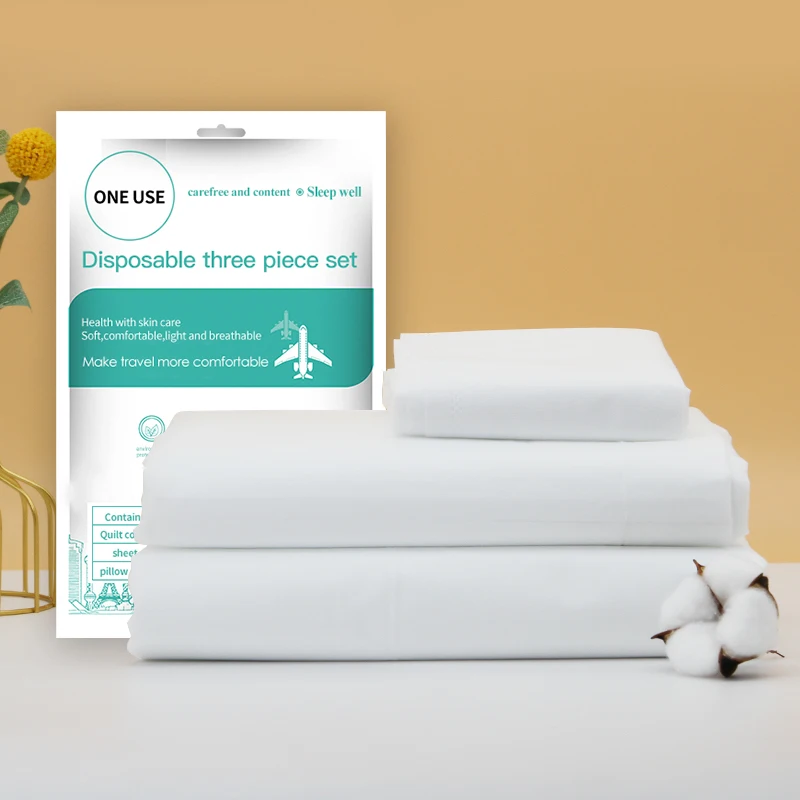 طقم مفروشات سفر disposable سرير مزدوج 4 قطع ثلاثي الطبقات مضاد للكهرباء الساكنة غير منسوج صديق للبيئة مقاوم للماء فاخر 300tc سرير