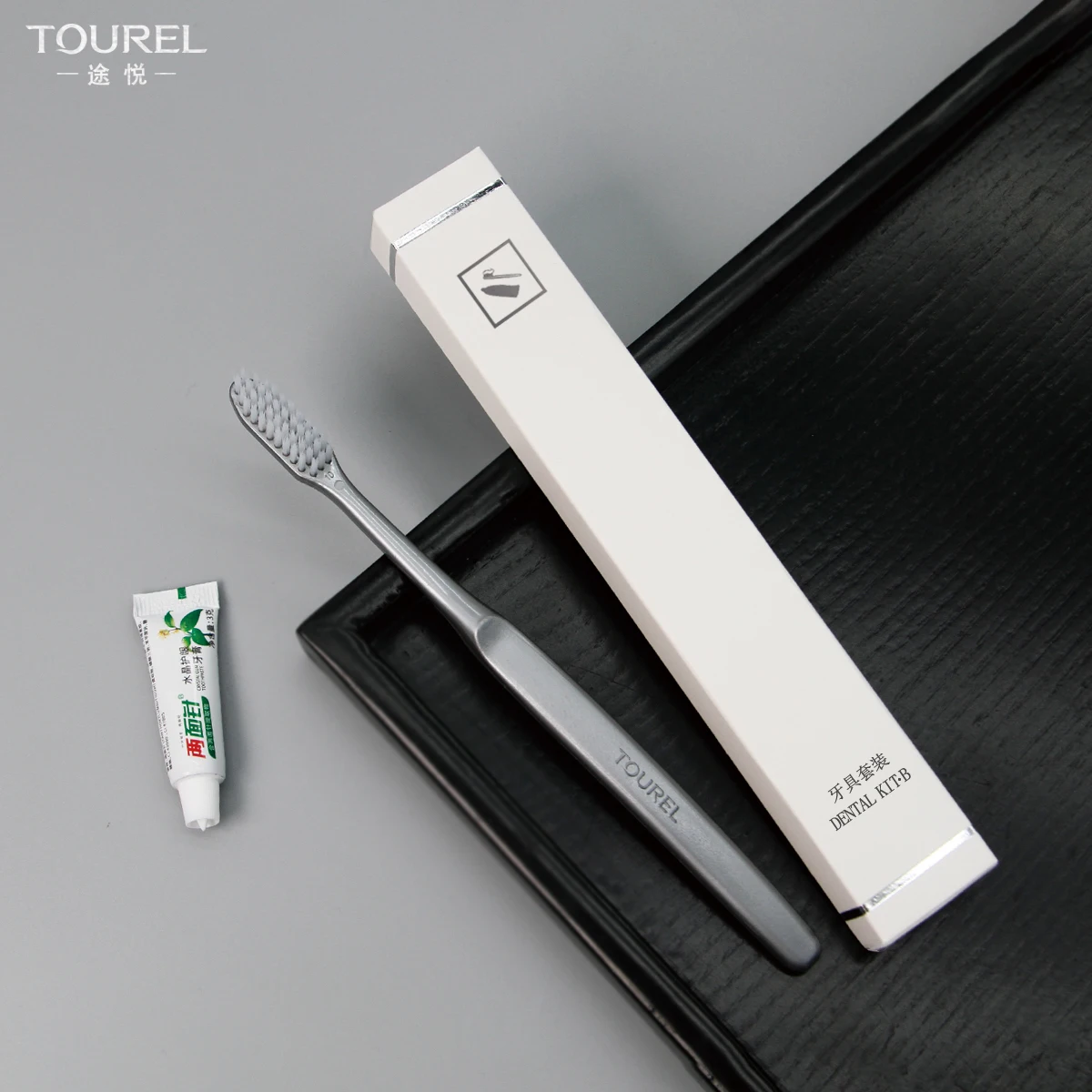 Cepillo de dientes desechable de hotel con cerdas de nailon a precio económico, de un solo uso, con cerdas duras y kit dental de plástico